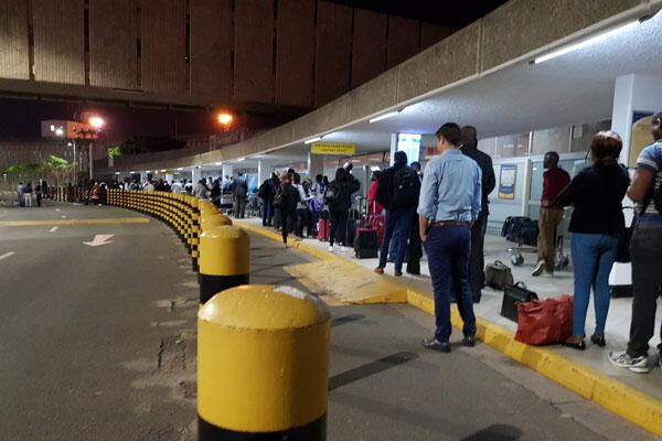 Passengers pictured at the Jomo Kenyatta International Airport (JKIA) following a disruption on March 6, 2019