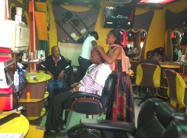 Nairobi Governor Mike Sonko's long-time barber pictured serving him at her shop in Nairobi's Buru Buru estate in 2016