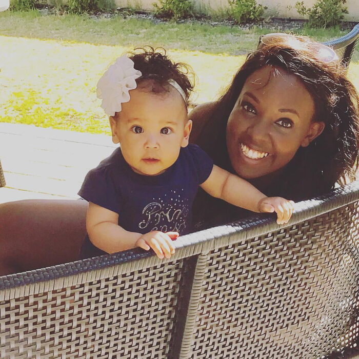 Vanessa Kiuna poses for a photo with her young daughter.