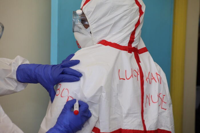 A medical practitioner has her name written on the protective gear at a Coronavirus isolation and treatment facility in Mbagathi District Hospital on Friday, March 6, 2020.