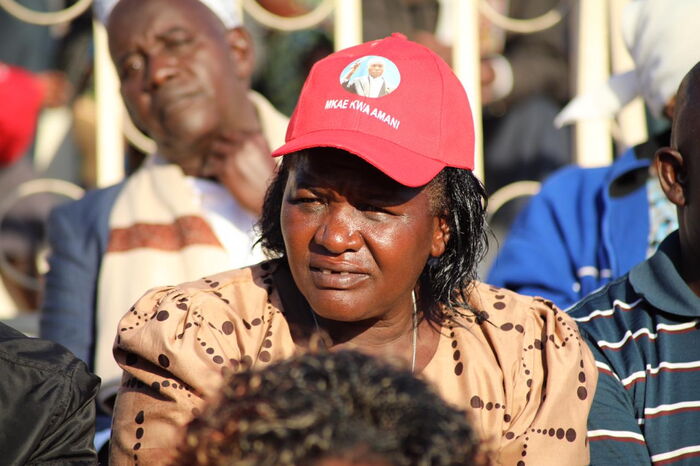 A Kenyan wearing a branded cap at Moi's requiem service 