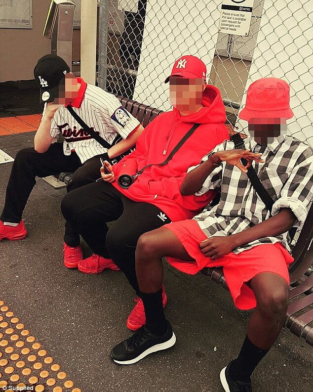 Youths identify themselves as members of the Reds by wearing signature red clothing including bandanas, hats and hoodies (pictured are local youths wearing red clothing)