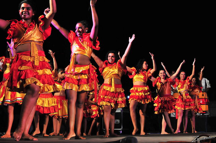 Members of the Kamba Cua community perform a traditional dance.