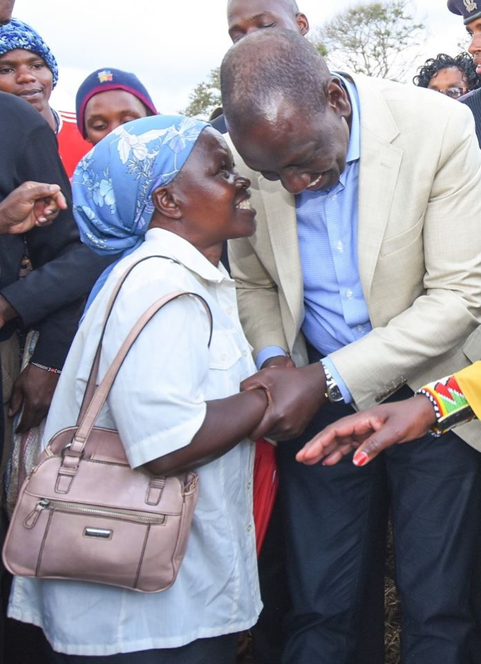 Deputy president William Ruto interacts with a resident at Gakoigo, Maragua on December 6
