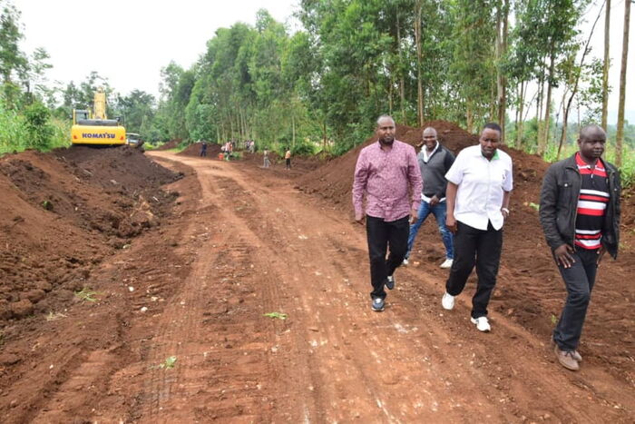 Suna East MP Junet Mohamed, in a brown ishirt, during the inispection of a road in his conistituency hours before he was taken ill on December 28