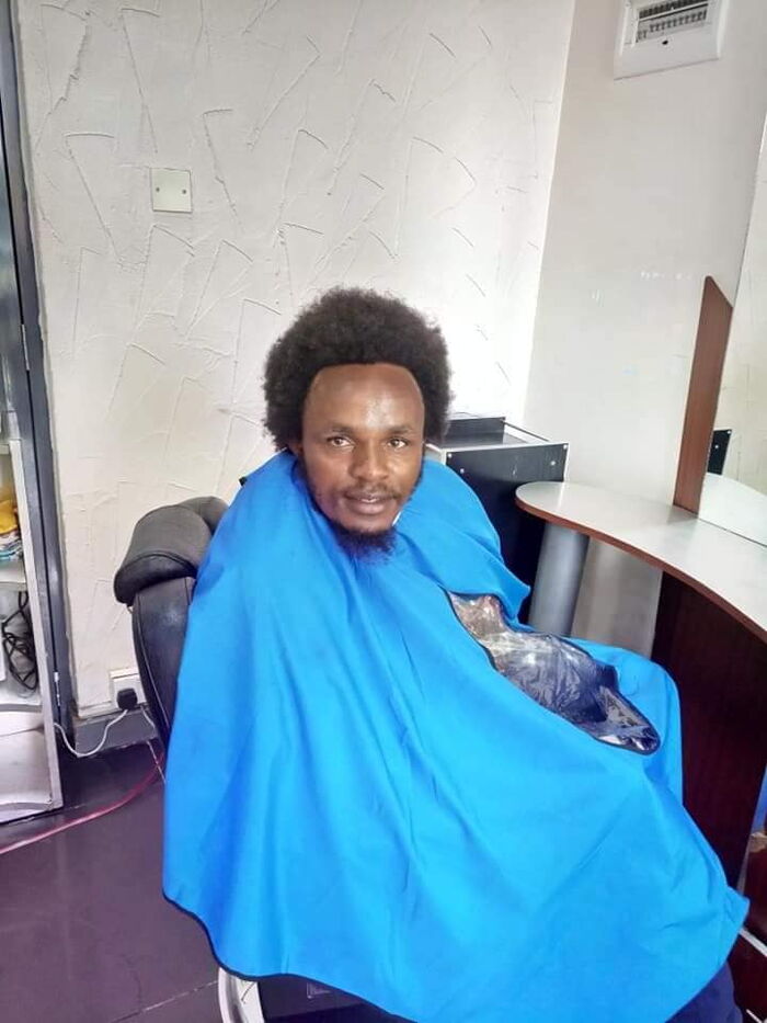 Zachary Kinuthia at an unidentified barbershop ready for a hair cut.