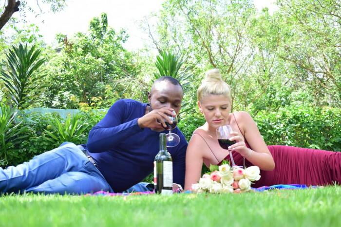 KTN journalist Tobias Chanji shares a glass of wine with his lover during their getaway on Sunday, January 5, 2020.