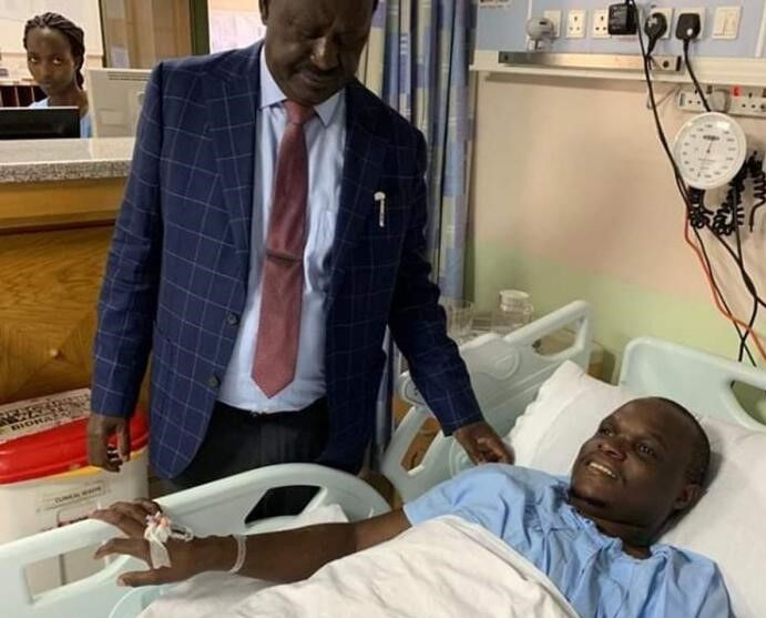 A photo of Raila visiting ailing Norman Magaya. Dikembe accused ODM leaders of disobeying Raila's orders for the ex-NASA boss's health to be given top priority status