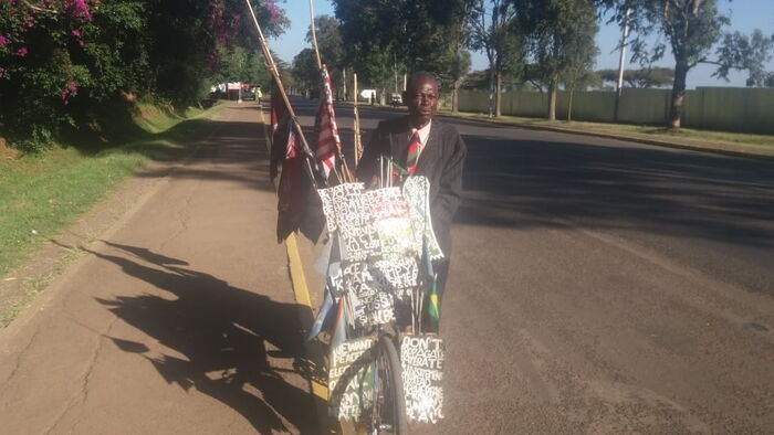  Nathan Ambuti on his bicycle.