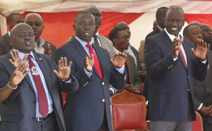 DP William Ruto with Nandi Governor Stephen Sang and Senator Kiprotich Cherargei during a Sunday service at St.Joseph Catholic Church in Mosoriot, Nandi County on May 21, 2018 