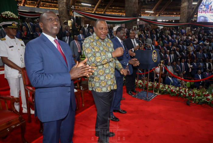 Deputy President William Ruto, President Uhuru Kenyatta, and opposition leader Raila Odinga singing during the launch of the BBI report at the Bomas of Kenya on Wednesday, November 27.