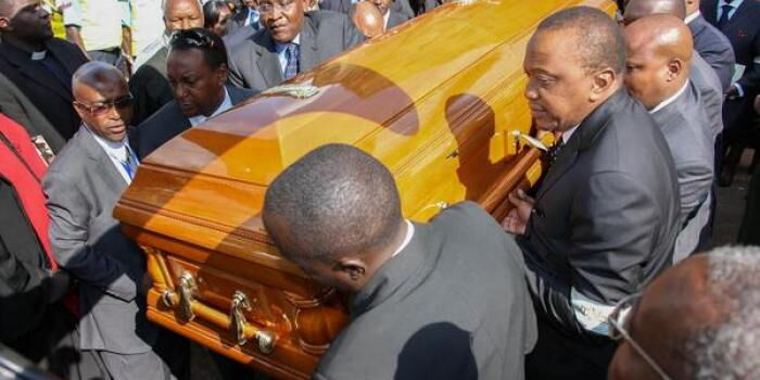 President Uhuru Kenyatta and other pallbearers during the burial of Dr.Njoroge Mungai in Kiambu on August 2014