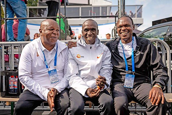 Eliud Kipchoge, his coach Patrick Sang (right) and physiotherapist Peter Nduhiu in Berlin in 2012