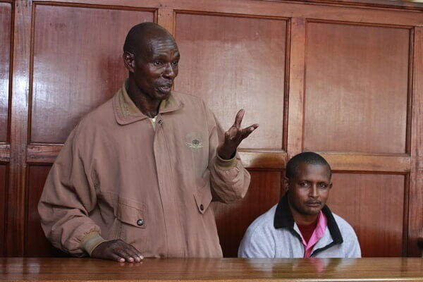 Kavinya Mwangangi and Simon Mutava before Milamani Law court where they confessed killing Catholic priest Michael Maingi