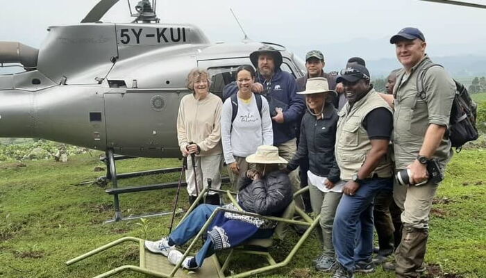 Charles Njonjo (seated) after he was awarded a certificate for tracking gorillas at Mgahinga Gorilla National Park in Uganda to mark his 100th birthday.