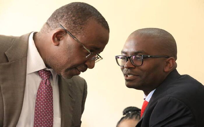 Meru Senator Mithika Linturi (left) talks to his lawyer Muthomi Thiankolu at a Milimani court on September 2, 2019. Muthomi told the court that his client as never been to Sopa Lounge in Naivasha