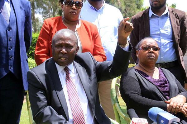 Nominated MP Maina Kamanda accompanied by DP William Ruto leaves an event in 2017