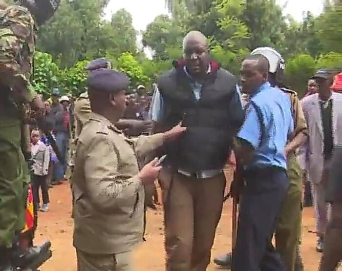 Nyeri Town Deputy Speaker Samuel Kariuki with police officers in Nyeri on Sunday, December 8.