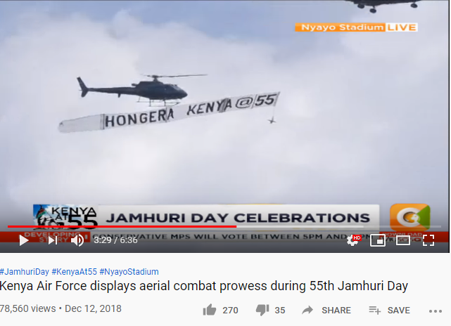 A screengrab of a military helicopter carrying a banner reading 'Hongera Kenya at 55' on December 12, 2018