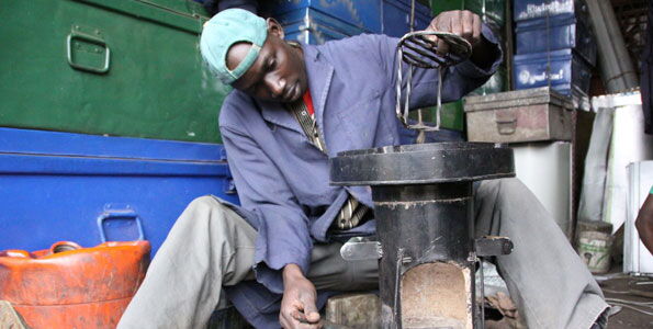 Morris Ochieng puts final touches to a stove at his business at the Jua Kali sheds in Eldoret