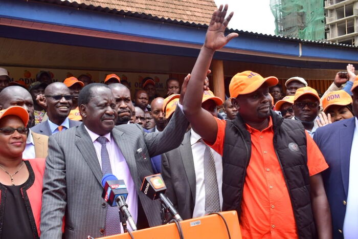 Former Prime Minister Raila Odinga and Kibra MP-elect Imran Okoth during campaigns 