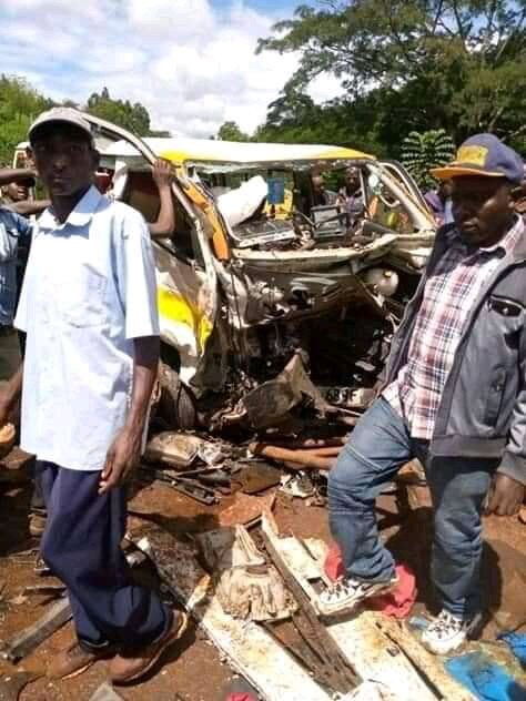 Members of the public walk past the wreckage at the scene of accident at Rupingazi, Embu on December 5