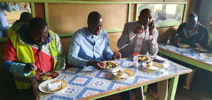 Moses Kuria shares meal with Kiharu MP Ndindi Nyoro and Murang'a residents on December 6