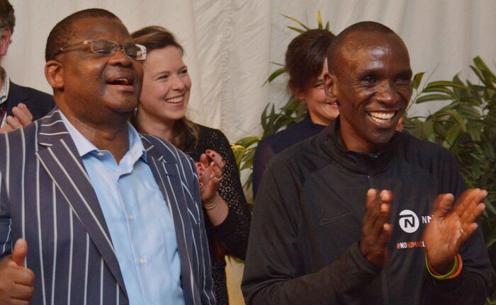 Eliud Kipchoge (r) enjoying himself at the party October 12, 2019