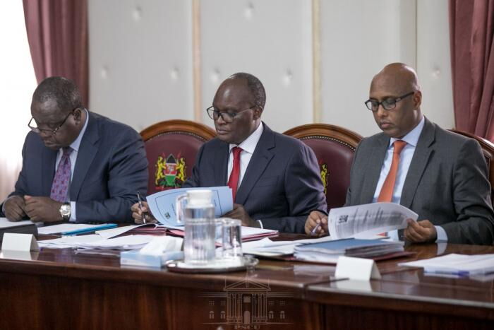 From left; Cabinet Secretaries Fred Matiang'i, James Macharia, and Adan Mohamed during a meeting at State House, Nairobi, on January 30, 2020.