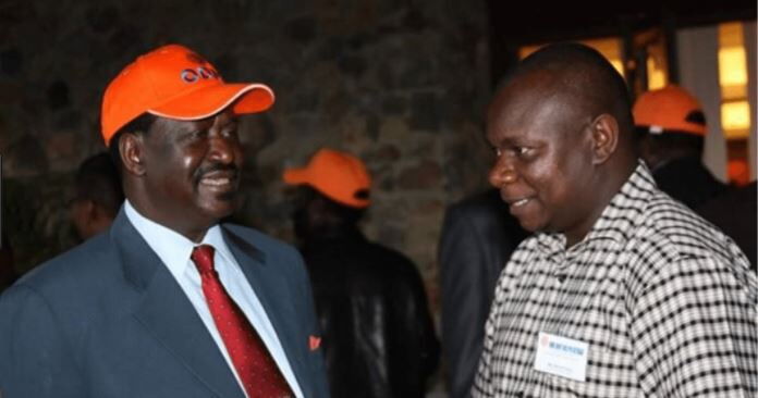 ODM Director of Communications Philip Etale (Right) with Raila Odinga. He has addressed allegations of receiving Ksh2 million bribe from Bernard 'Imran' Okoth.