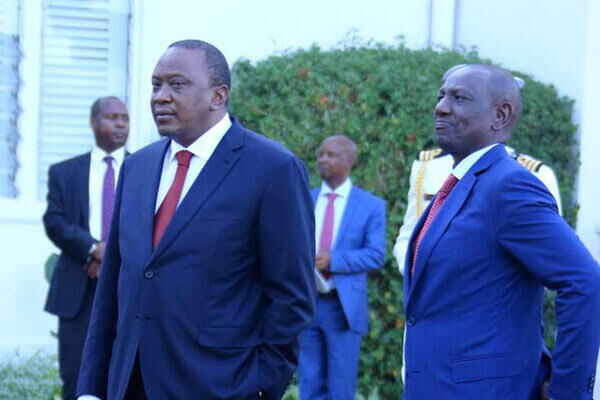 President Uhuru Kenyatta with Deputy President William Ruto when they hosted French President Emmanuel Macron at State House in Nairobi on March 13, 2019.