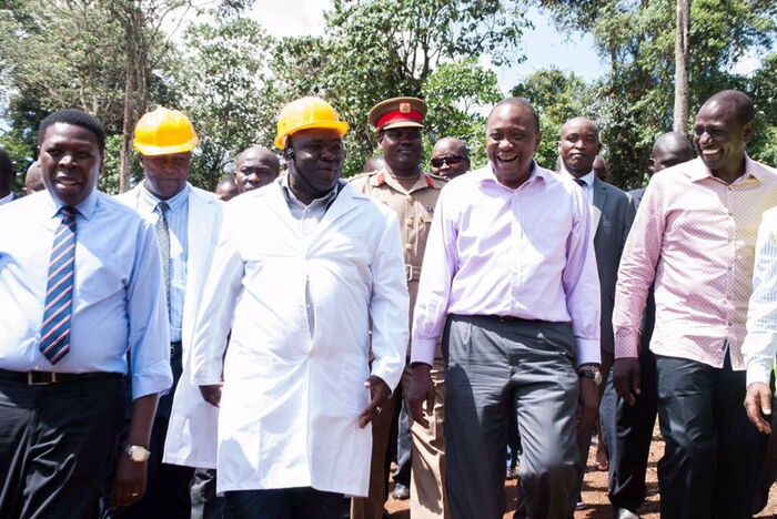 Athi Water Services Board Director Bill Arocho (in hard-hat) accompanies President Uhuru Kenyatta and Deputy President William Ruto to inspect a project in April 2016