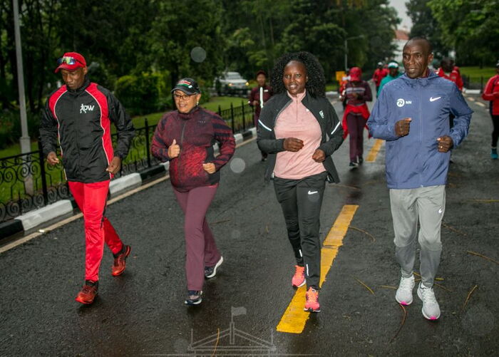 From Left: Douglas Wakiihuri, Margaret Kenyatta, Grace and Eluid Kipchoge during a morning run at State House on Tuesday, December 3.