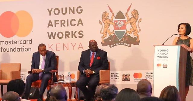 Gina Din at the Young Africa Works Kenya. Looking on is the Education CS George Magoha and President Uhuru Kenyatta.