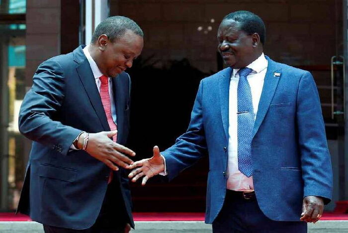 President Uhuru Kenyatta (L) and the ODM leader Raila Odinga on the footsteps of the Harambee House on Friday, March 9, during the much touted Handshake.