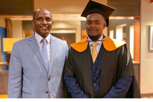 Ukur Yatani poses for a photo with his son Ibrae after he graduated with an LLM form the University of Kent, UK on Saturday, November 23, 2019