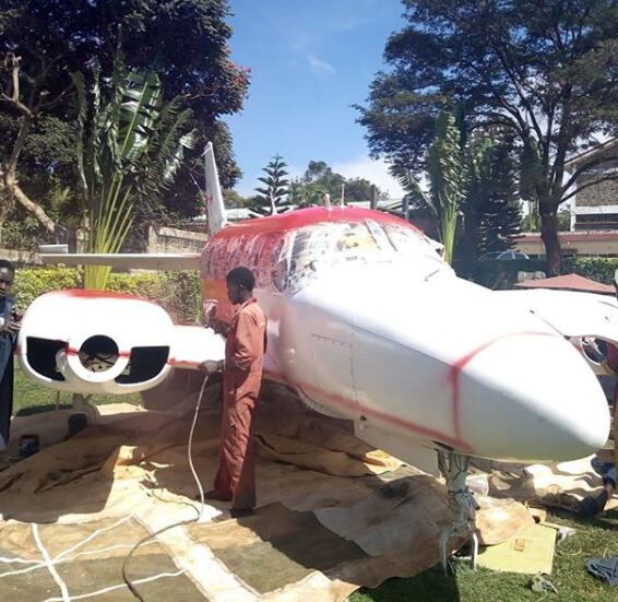 Image of workers carrying out paintwork on Jaguar's plane. Starehe MP commissioned the refurbishment of the plane shell he recently acquired