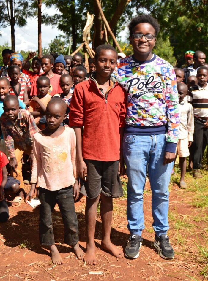 Dean Ngirici(in spectacles) with members of the public from Kiorugari village,Kirinyaga county 