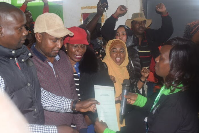 ODM's Imran Okoth recieving his IEBC victory certificate on Friday, November 8.