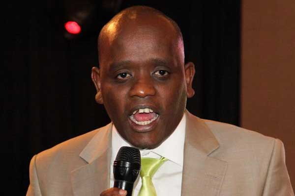 A photo of Dennis Itumbi speaking in a past event