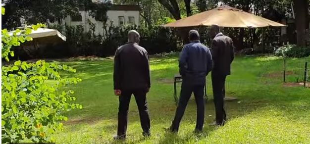 Jeff Koinange flanked by two unidetified men at Royal Media Services offices on January 8, 2020.