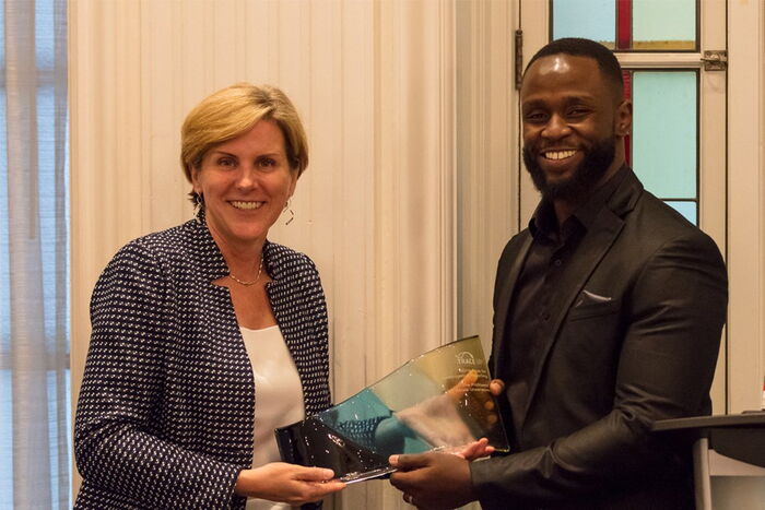 Trace International CEO Alexandra Wrage presenting an award to Africa Uncensored's investigative journalist John Allan Namu (right) in Vancouver, Canada on June 26, 2019.