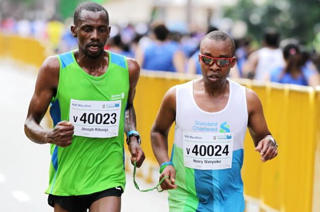 Joseph Kibunja and Henry Wanyoike at the Standard Chartered Marathon in November 2017.