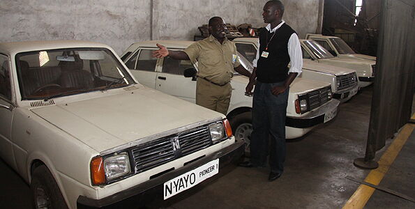Numerical Machining Complex CEO, George Onyango amidst an array of the Nyayo Pioneer cars that the corporation used to put together in the 1990s.