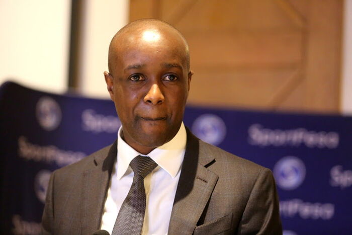 Image of Sportpesa CEO Ronald Karauri listening to a question at a past press conference