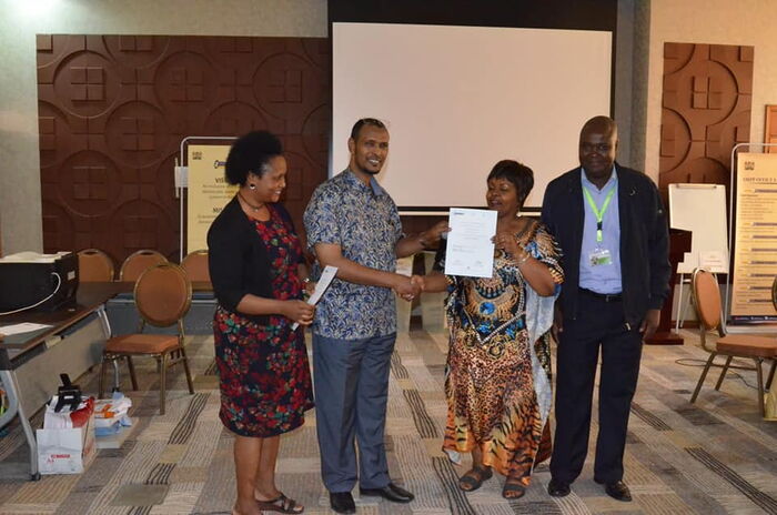 Director of Membership Rosemary Kariuki-Machua receiving the Political Parties Liaison Committee (PPLC) certificate from the Registrar of Political Parties Ann Nderitu and IEBC Commissioner Abdi Guliye on April 17, 2019.