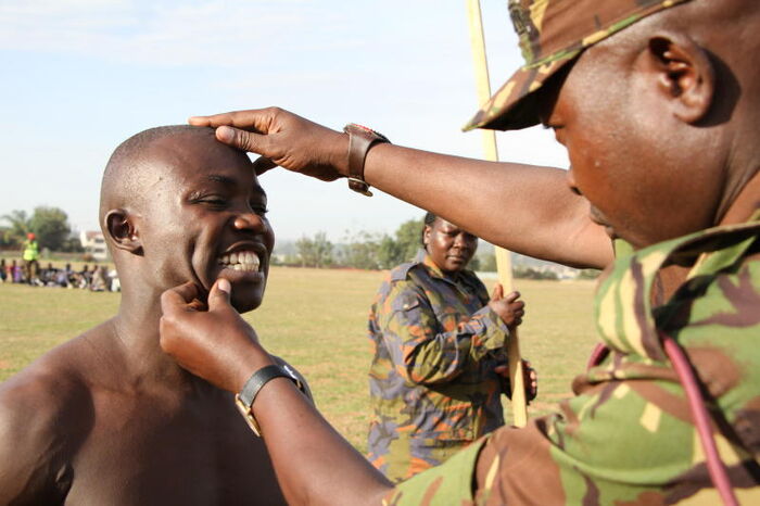 A candidate being checked by a KDF officer during recruitment in 2018. Photo: Daily Nation.