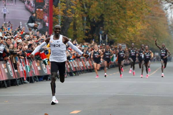 Kenya's Eliud Kipchoge celebrates as he gets to the finish line at the end of his historic sub-two-hour marathon on October 12, 2019, in Vienna, Austria.