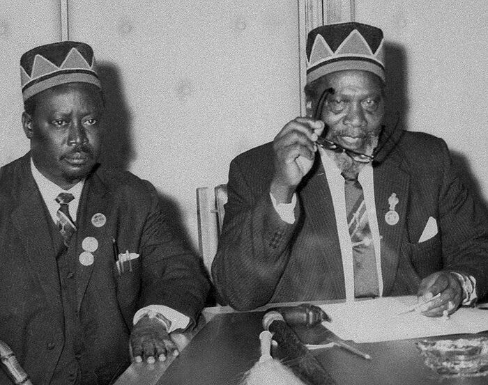 Kenyatta and Jaramogi wearing similar hats in an undated photo. After their bitter fallout in 1966, Kenyatta never wore the cap and it disappeared for 36 years.