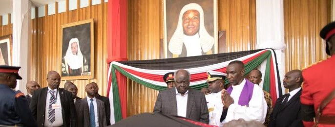 Former President Mwai Kibaki pays his last respects to his predecessor Daniel Arap Moi at Parliament buildings on Sunday, February 9